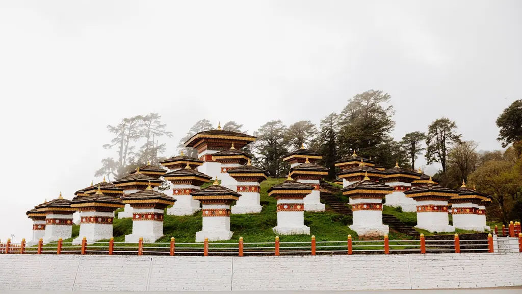 The 108 whitewashed chortens at Dochula Pass on a misty hillside
